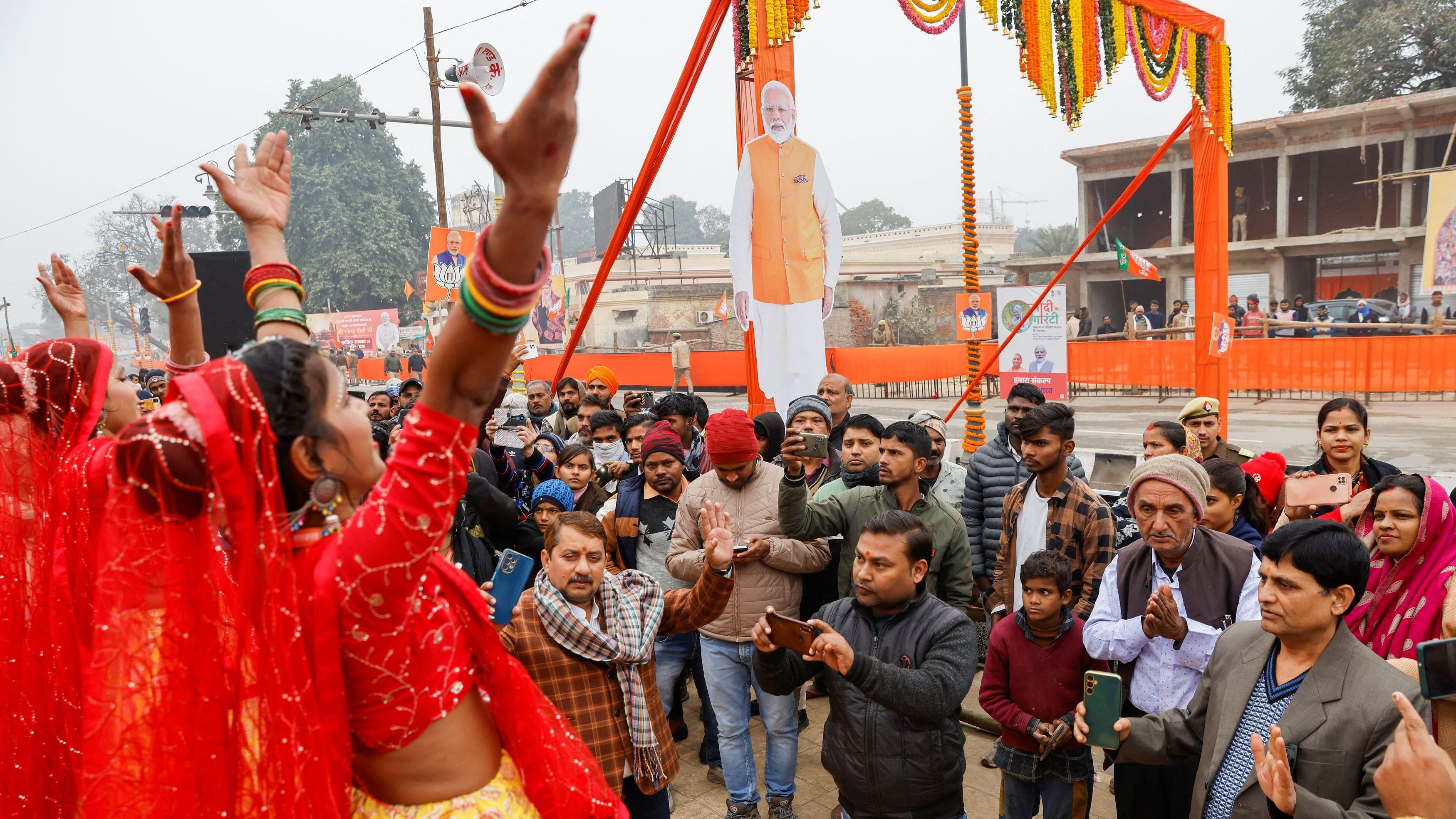 <div class="paragraphs"><p>People watch dance performaces ahead of India's Prime Minister Narendra Modi's roadshow in Ayodhya.&nbsp;</p></div>