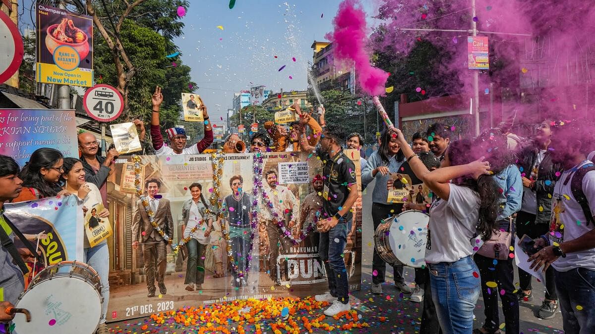 <div class="paragraphs"><p>Bollywood superstar Shah Rukh Khan's fans celebrate before the screening of the first show of the film 'Dunki' outside a cinema hall, in Kolkata.</p></div>
