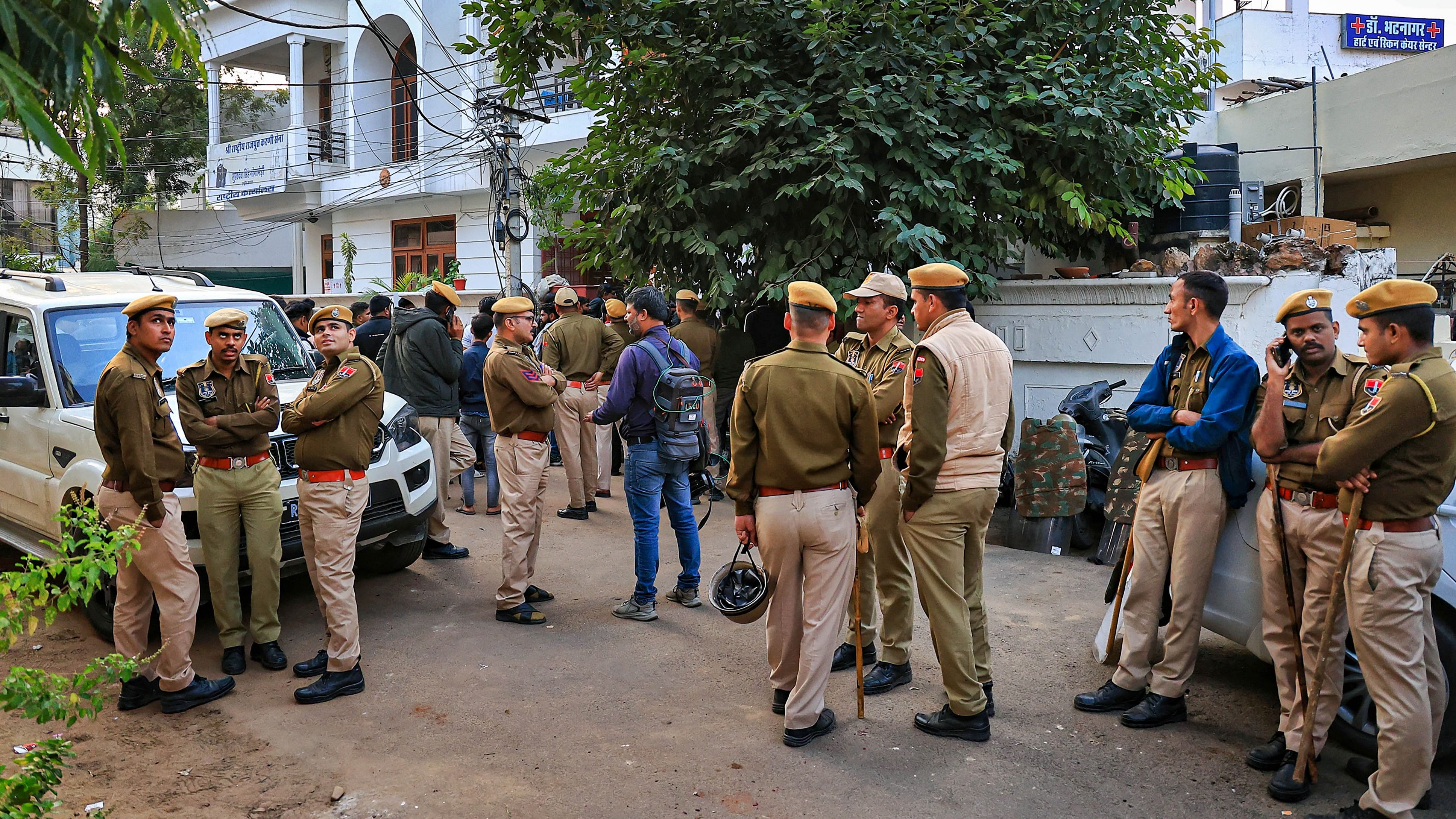 <div class="paragraphs"><p>Police personnel and FSL team members outside the residence of Shri Rashtriya Rajput Karni Sena's President Sukhdev Singh Gogamedi, where he was shot dead by unidentified assailants, in Jaipur, Tuesday, Dec. 5, 2023.</p></div>