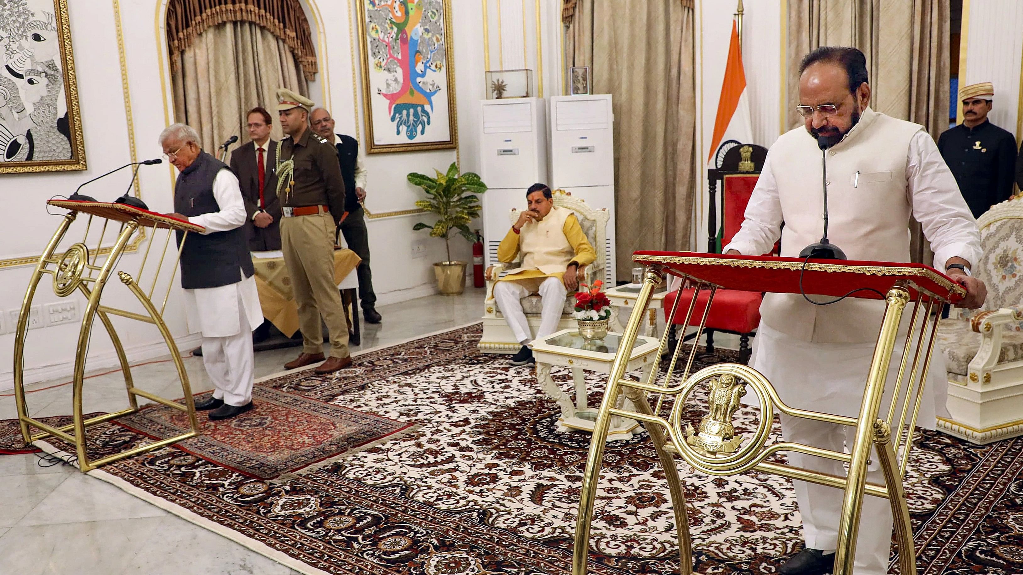 <div class="paragraphs"><p>Madhya Pradesh Governor Mangubhai Patel administers oath to BJP leader Gopal Bhargava as Pro-tem Speaker of State Assembly, at Raj Bhavan in Bhopal, Thursday, Dec 14, 2023. </p></div>