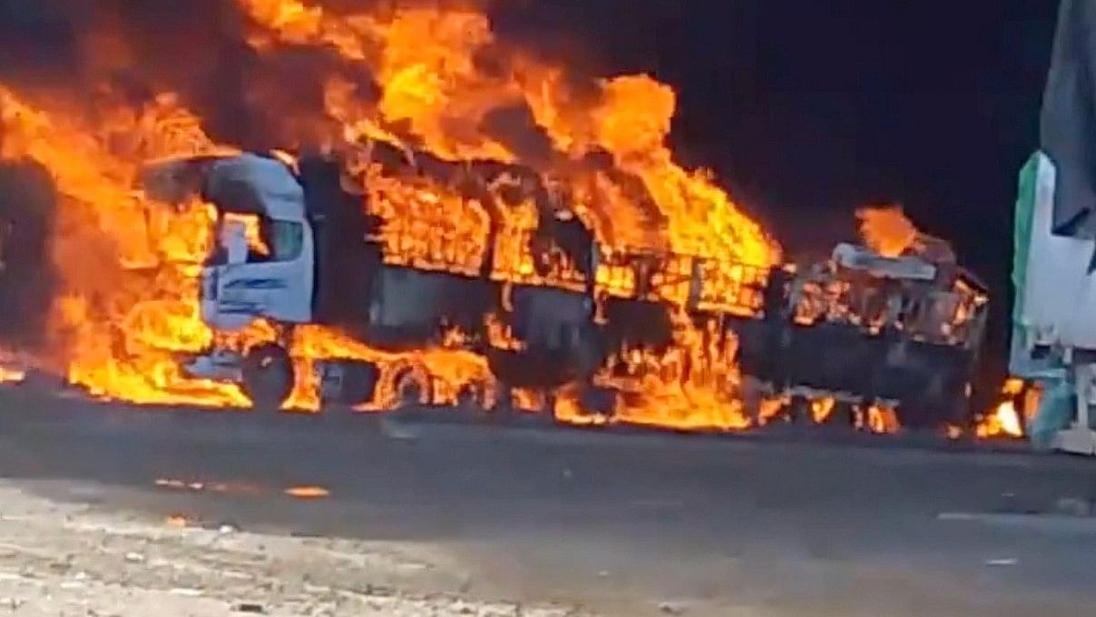 <div class="paragraphs"><p>Smoke rises from a burning truck near the Myanmar border, November 23, 2023.</p></div>