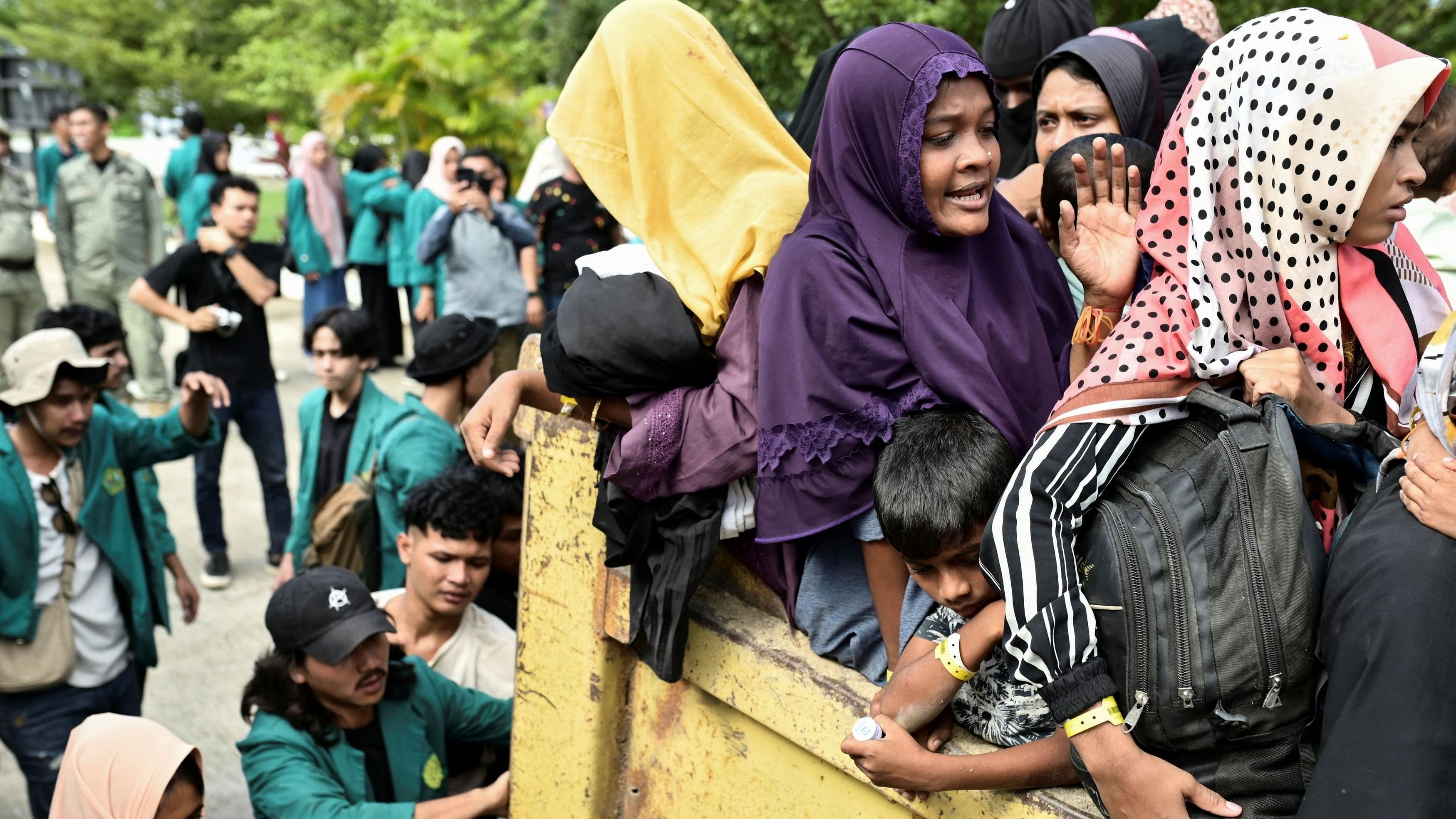 <div class="paragraphs"><p>Rohingya refugees are transported as they are relocated from their temporary shelter at Balai Meuseuraya Aceh, following a protest for the deportation of the Rohingya refugees in Banda Aceh, Indonesia.</p></div>