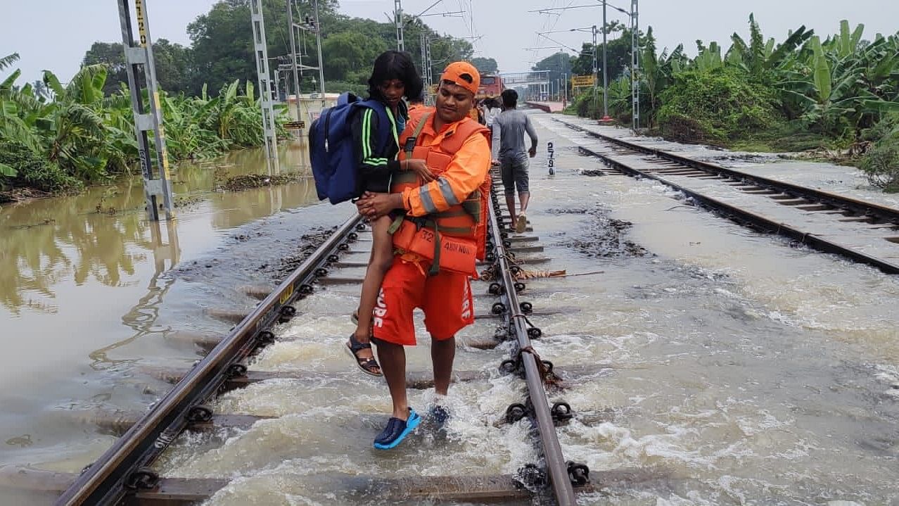 <div class="paragraphs"><p>A rescue personnel carries a child during the evacuation for the train passengers.&nbsp;</p></div>