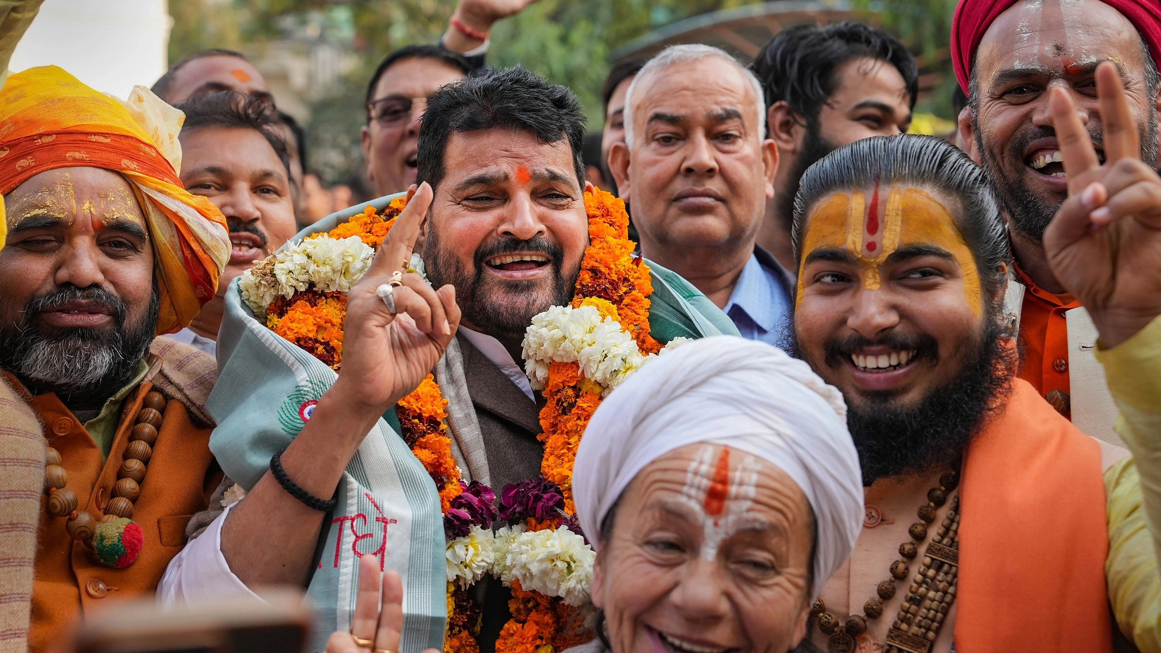 <div class="paragraphs"><p>BJP MP Brij Bhushan Sharan Singh with supporters reacts after UP Wrestling Association Vice President Sanjay Singh became the new President of the Wrestling Federation of India (WFI), in New Delhi, Thursday, Dec. 21, 2023.&nbsp;</p></div>