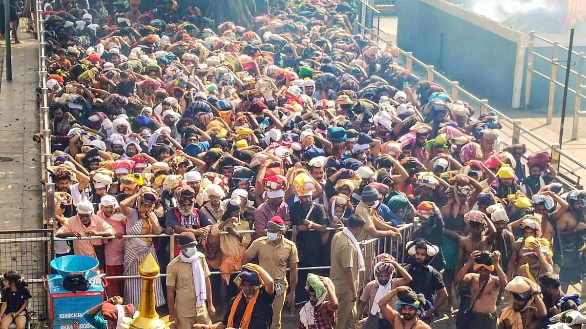 <div class="paragraphs"><p>Ayyappa devotees wait to offer prayers at Sabarimala temple, in Pathanamthitta earlier in December</p></div>