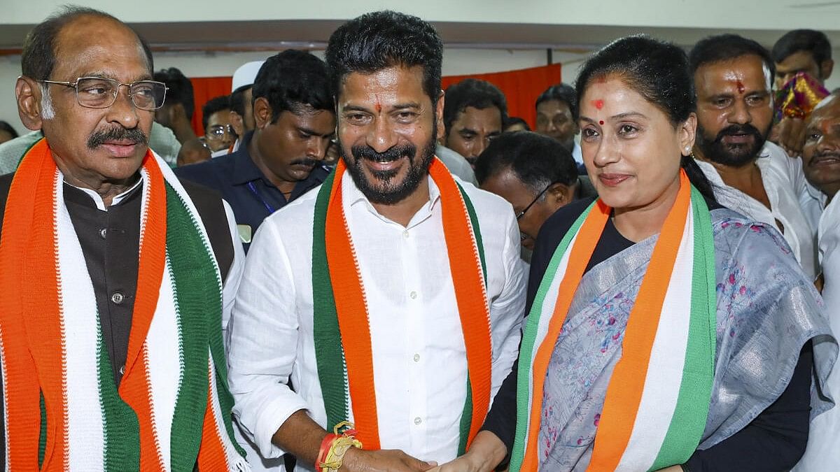 <div class="paragraphs"><p>Telangana Congress chief A. Revanth Reddy with party leader Vijayashanti celebrates as party leads during counting of votes for Telangana Assembly elections, in Hyderabad.</p></div>