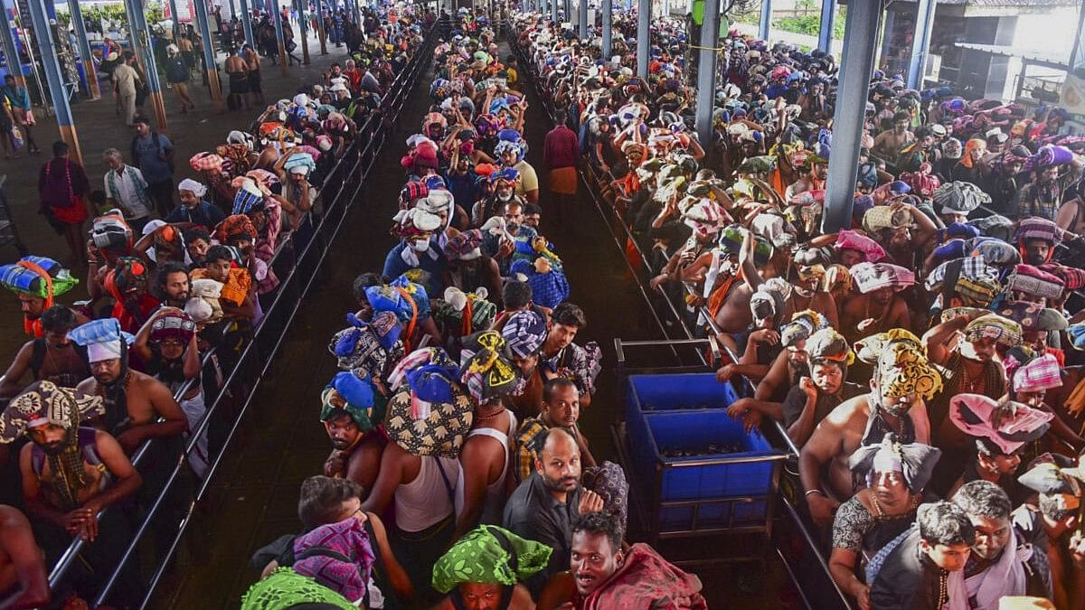 <div class="paragraphs"><p>Ayyappa devotees at Sabarimala temple, in Pathanamthitta, Monday.</p></div>