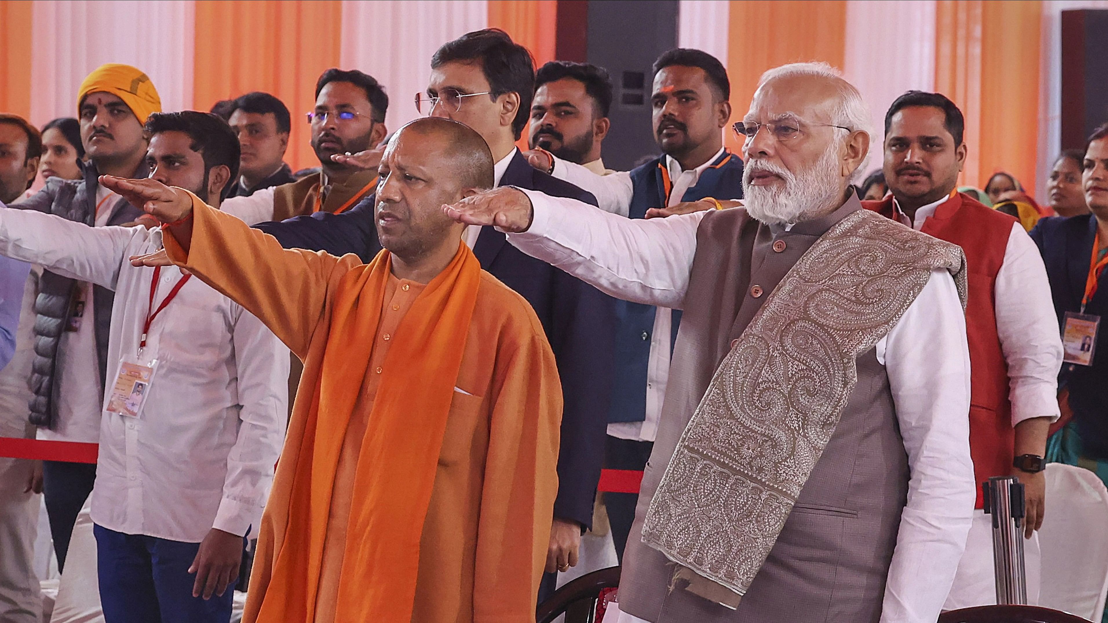 <div class="paragraphs"><p>Prime Minister Narendra Modi with Uttar Pradesh Chief Minister Yogi Adityanath and others take a pledge at the 'Viksit Bharat Sankalp Yatra', in Varanasi, Sunday, Dec. 17, 2023. </p></div>