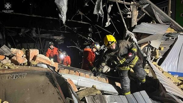 <div class="paragraphs"><p>Firefighters work at a site of a warehouse heavily damaged during a Russian drone strike, amid Russia's attack on Ukraine, in Kyiv region, Ukraine, released December 21, 2023</p></div>