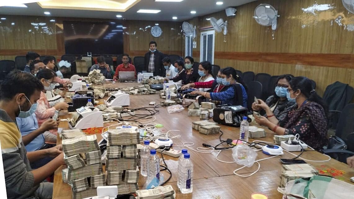 <div class="paragraphs"><p>Counting of cash by officials on the 5th day of the Income Tax department raids against Odisha-based distillery and linked entities, in Ranchi.&nbsp;</p></div>