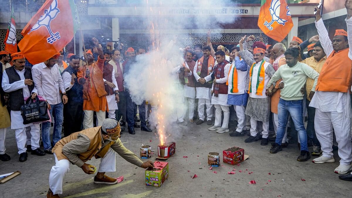 <div class="paragraphs"><p>BJP workers and supporters celebrate the party's lead in Madhya Pradesh, Rajasthan and Chhattisgarh during counting of votes for the Assembly elections, in Lucknow.&nbsp;</p></div>