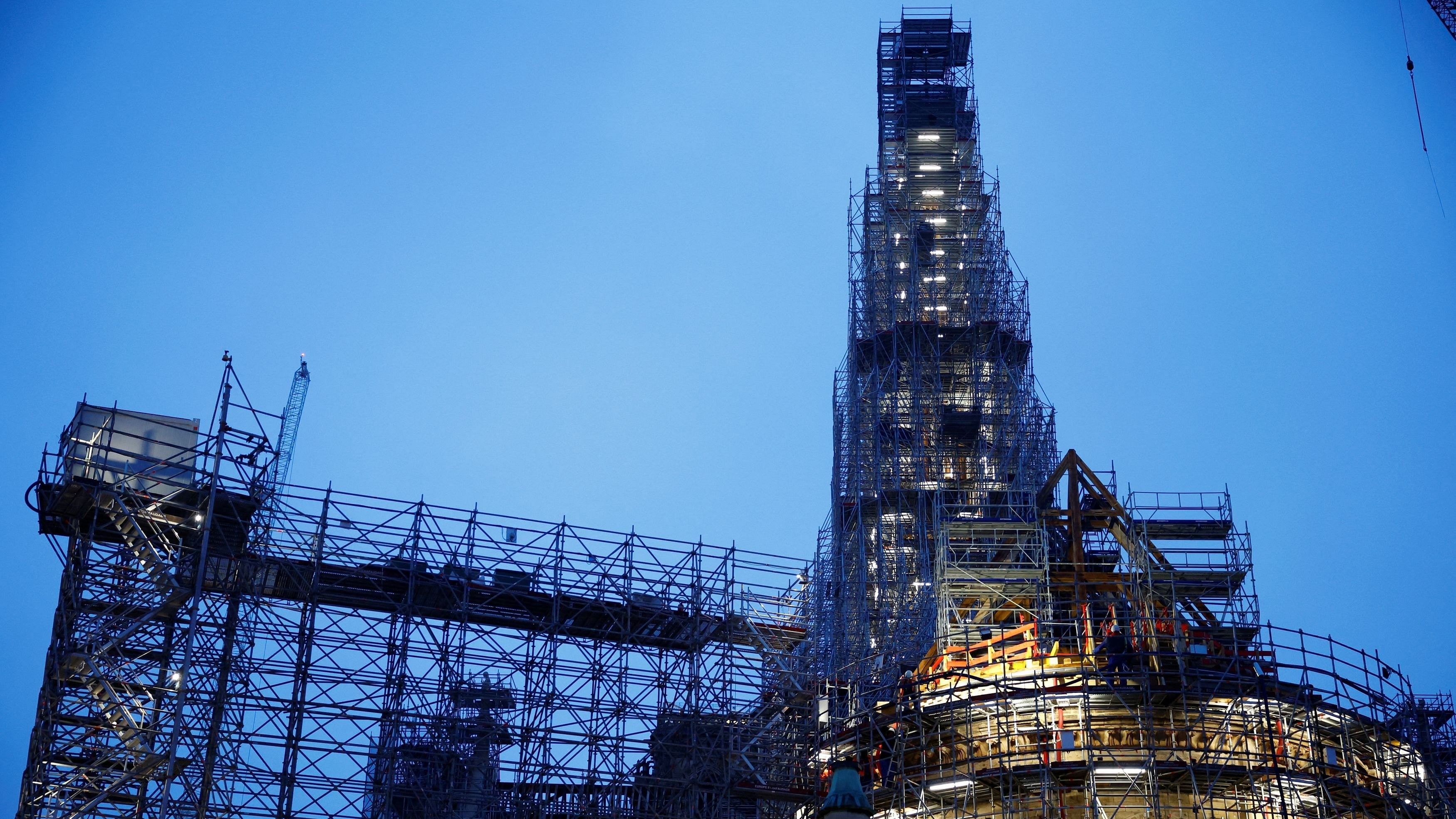 <div class="paragraphs"><p>View of high scaffolding and the framework of the new spire of the Notre-Dame Cathedral, which was ravaged by a fire in 2019 that sent its spire crumbling down, as restoration works continue a year before its reopening to the public, in Paris, France, December 8, 2023.  </p></div>