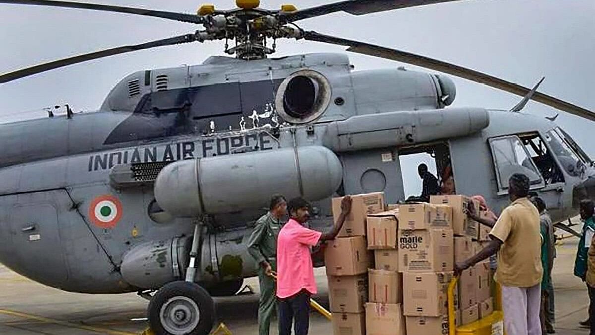 <div class="paragraphs"><p>Relief material being unloaded from an Indian Air Force helicopter for the flood-affected people after heavy rains, in Tirunelveli.</p></div>