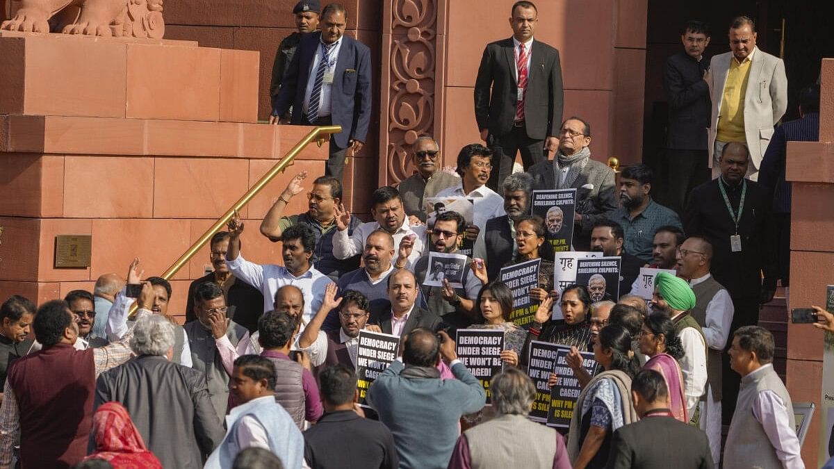 <div class="paragraphs"><p>Suspended opposition MPs protest during the Winter session of Parliament, in New Delhi.</p></div>