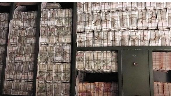 <div class="paragraphs"><p>Cash seized by the Income Tax department after raids against a Odisha-based distellery group and linked entities.</p></div>