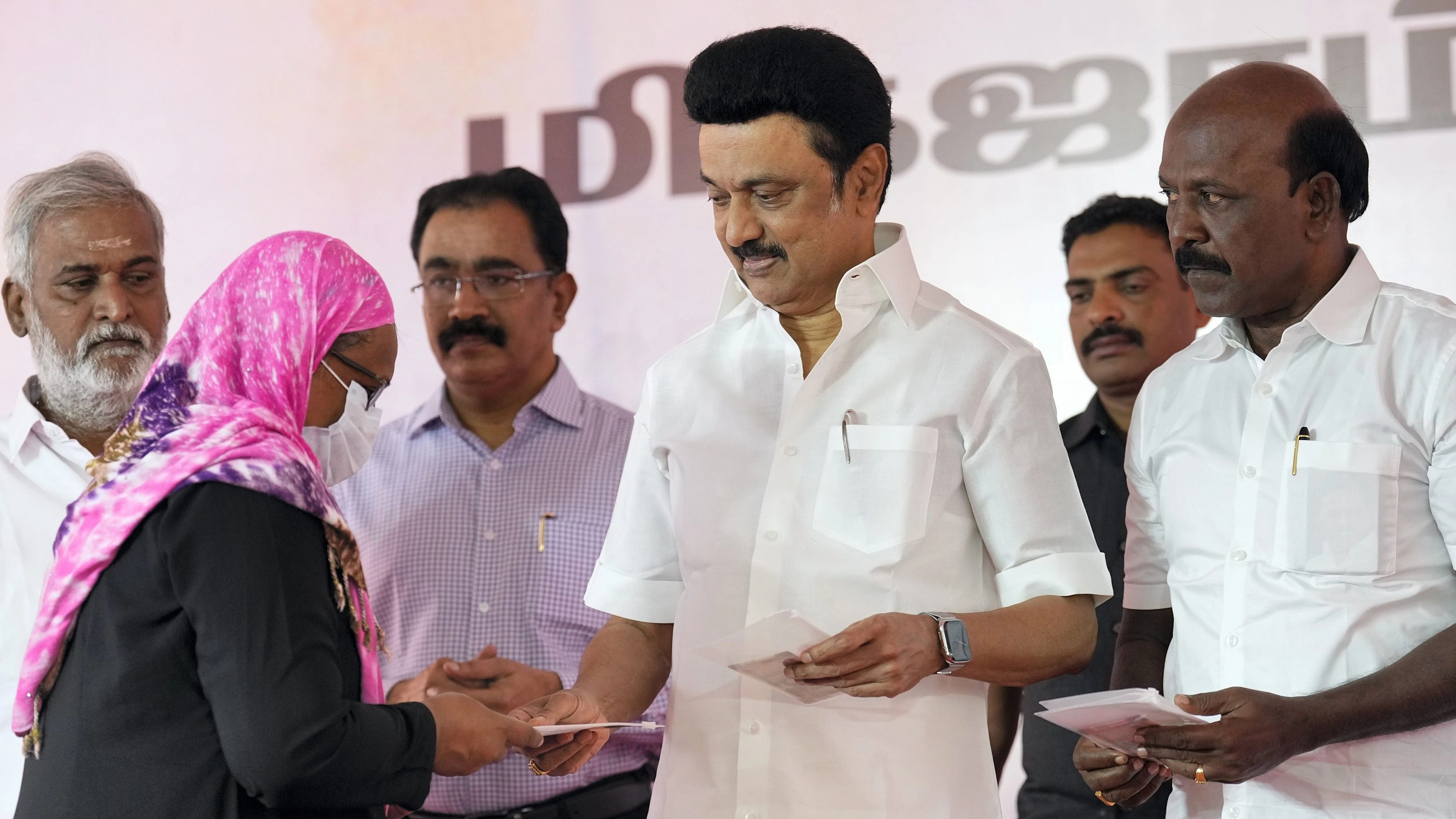 <div class="paragraphs"><p> Tamil Nadu Chief Minister MK Stalin distributes the relief amount during the launch of Rs 6,000 cash assistance to families affected by Cyclone Michaung induced rains and flood, in Chennai, Sunday, Dec 17, 2023. </p></div>