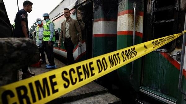 <div class="paragraphs"><p>Crime Scene Unit members inspect the passenger train that was set on fire during a countrywide strike called by the Bangladesh Nationalist Party, in Dhaka.</p></div>