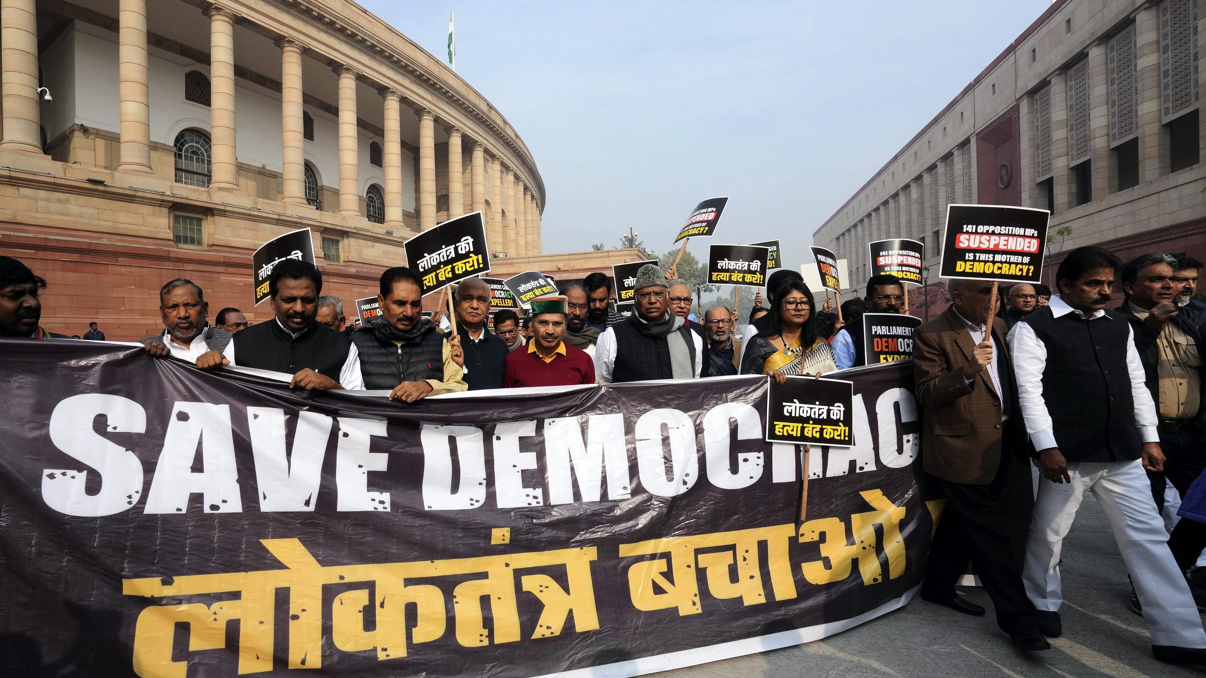 <div class="paragraphs"><p>Leader of Opposition in the Rajya Sabha Mallikarjun Kharge with suspended opposition MPs during a protest over their suspension at Mahatma Gandhi statue amid the Winter session of Parliament, in New Delhi, Thursday, Dec. 21, 2023. </p></div>