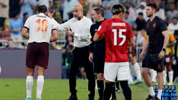 <div class="paragraphs"><p>Manchester City manager Pep Guardiola with Rodri during&nbsp;Urawa Red Diamonds vs Manchester City at the King Abdullah Sports City, Jeddah, Saudi Arabia, on December 19, 2023</p></div>