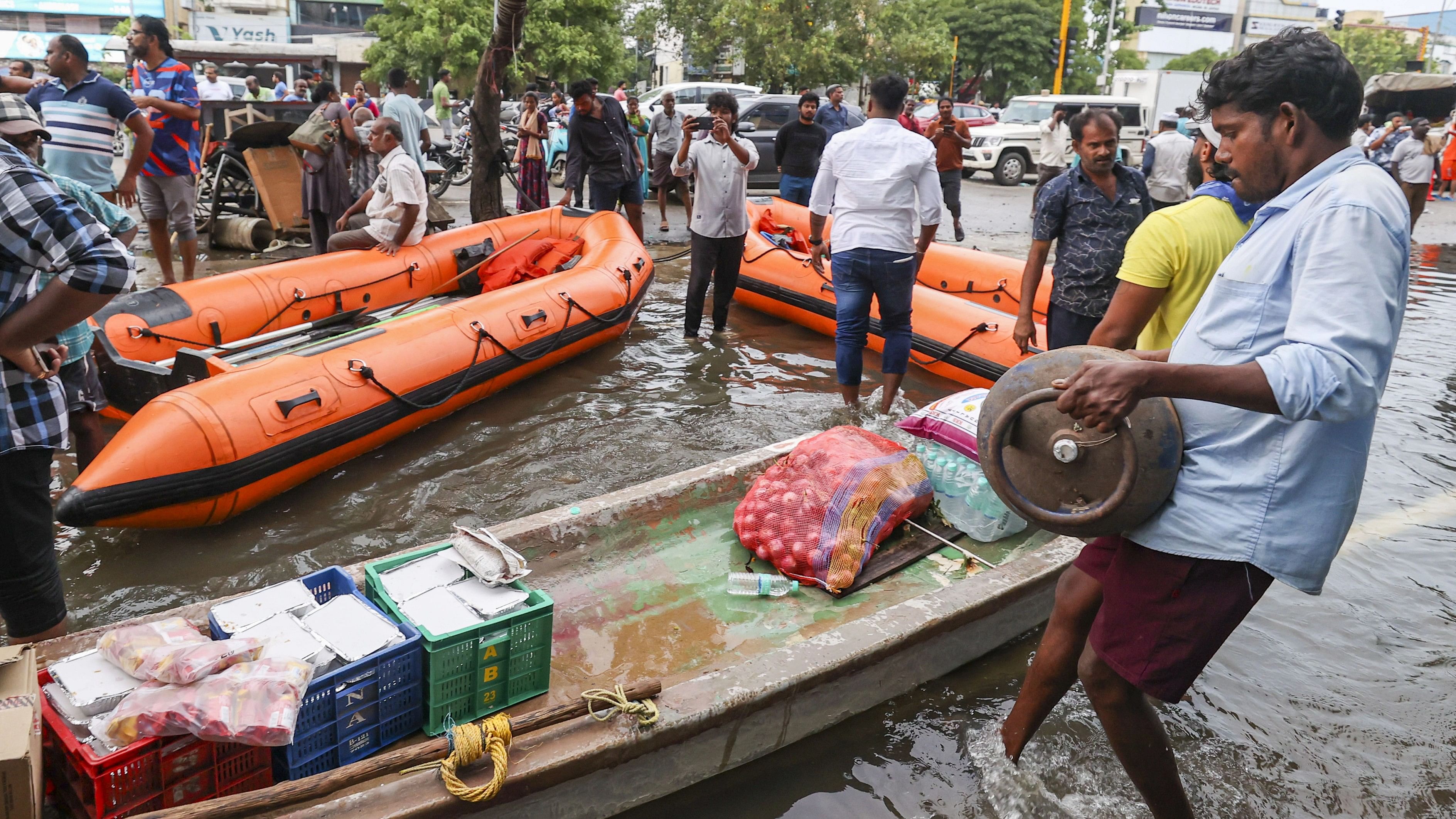 <div class="paragraphs"><p>Food and other essential items being distributed to those who are stranded inside their home due to flooding after the landfall of Cyclone Michaung, in Chennai.</p></div>