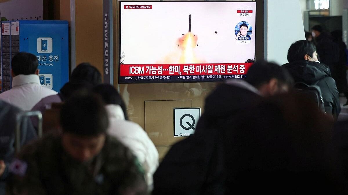 <div class="paragraphs"><p>People watch a TV broadcasting a news report on North Korea firing what appeared to be a long-range ballistic missile, at a railway station in Seoul.</p></div>