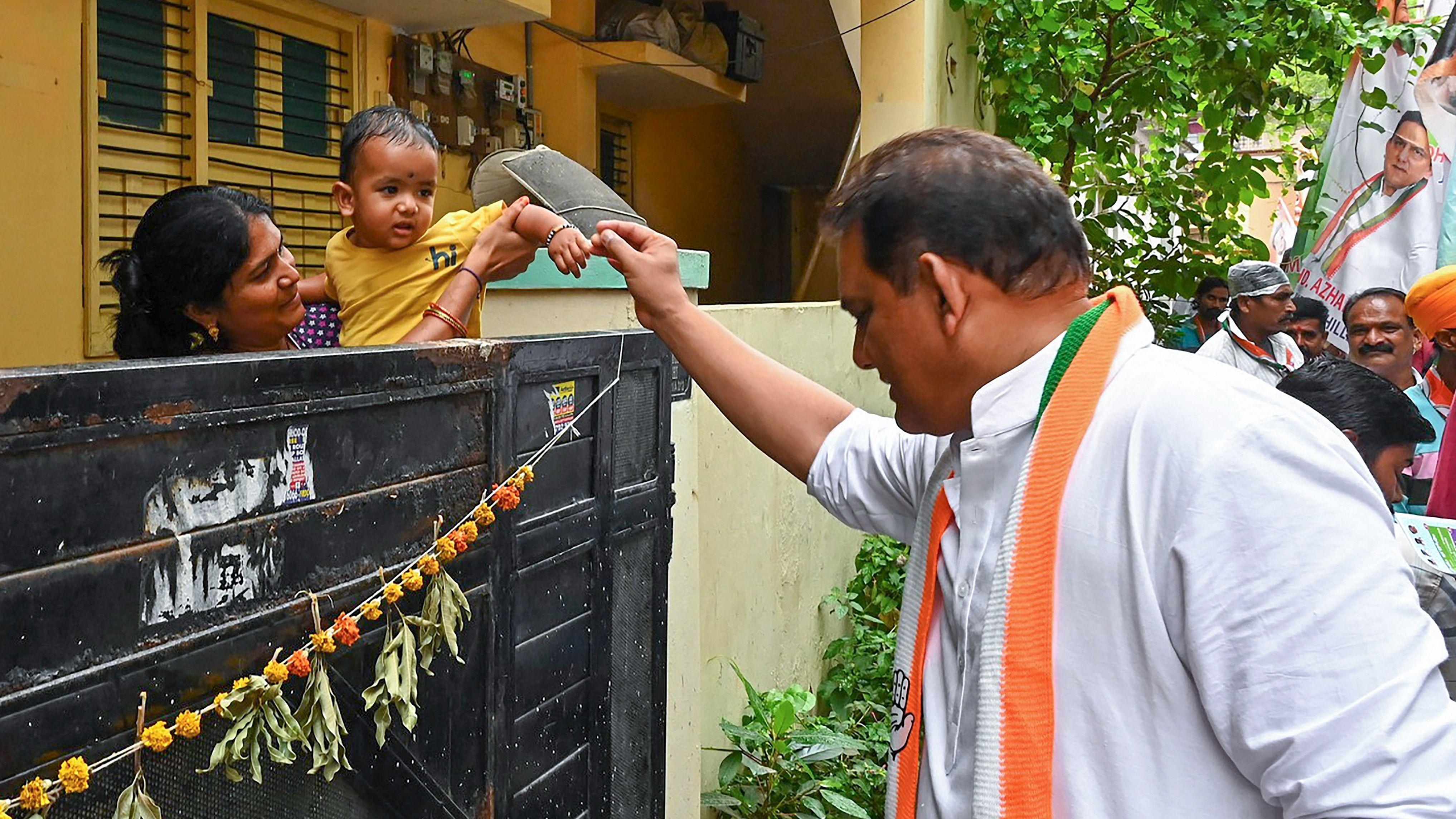 <div class="paragraphs"><p>Congress MP Mohammed Azharuddin interacts with locals during door to door election campaigning at Jubilee Hills constituency ahead of Telangana Assembly elections, in Hyderabad, Friday, Nov. 24, 2023.</p></div>