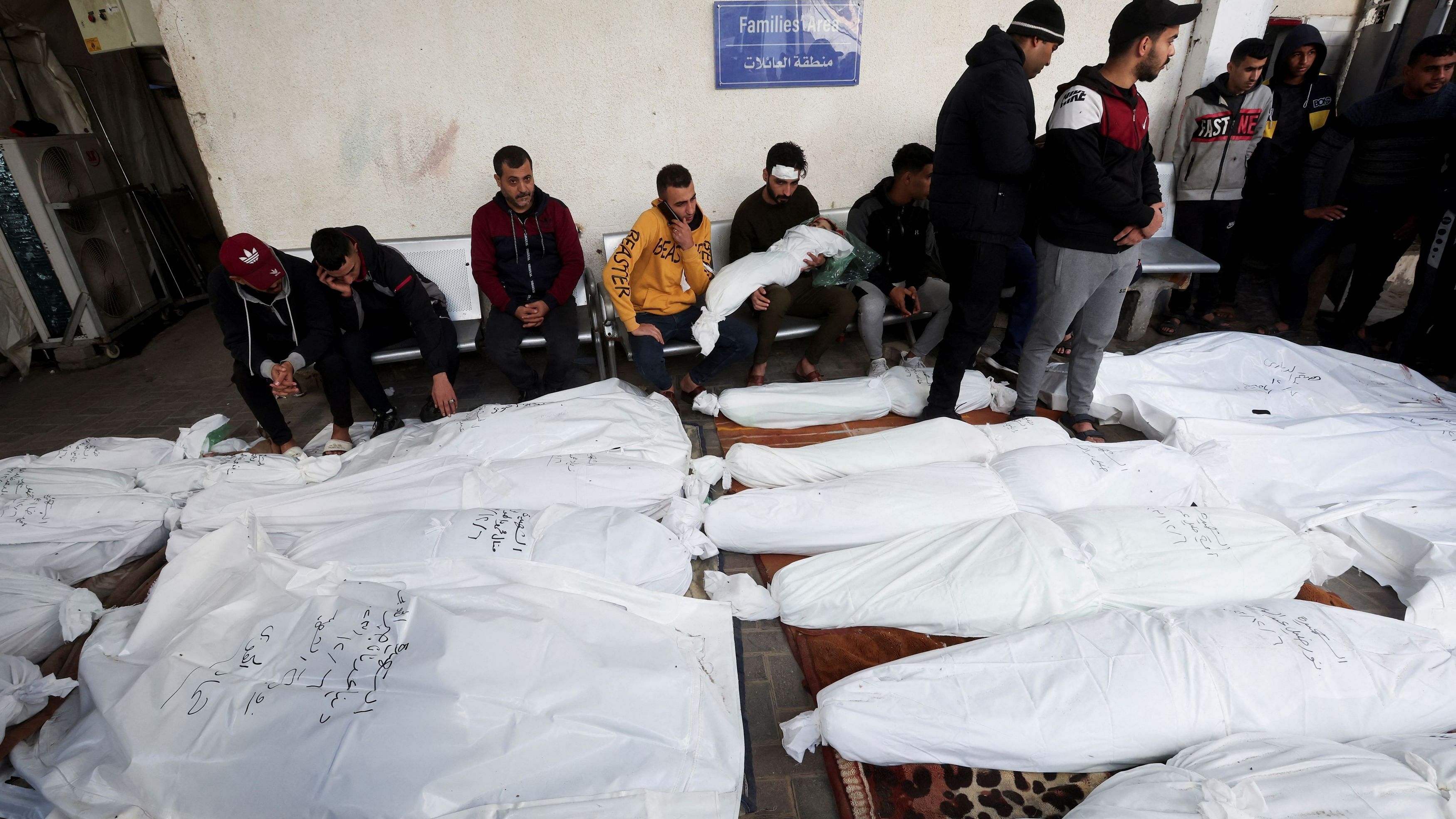 <div class="paragraphs"><p> Palestinian man holds the body of a child as people mourn near the bodies of Palestinians killed in Israeli strikes on houses, at Abu Yousef al-Najjar hospital in Rafah in the southern Gaza Strip, December 7, 2023. </p></div>