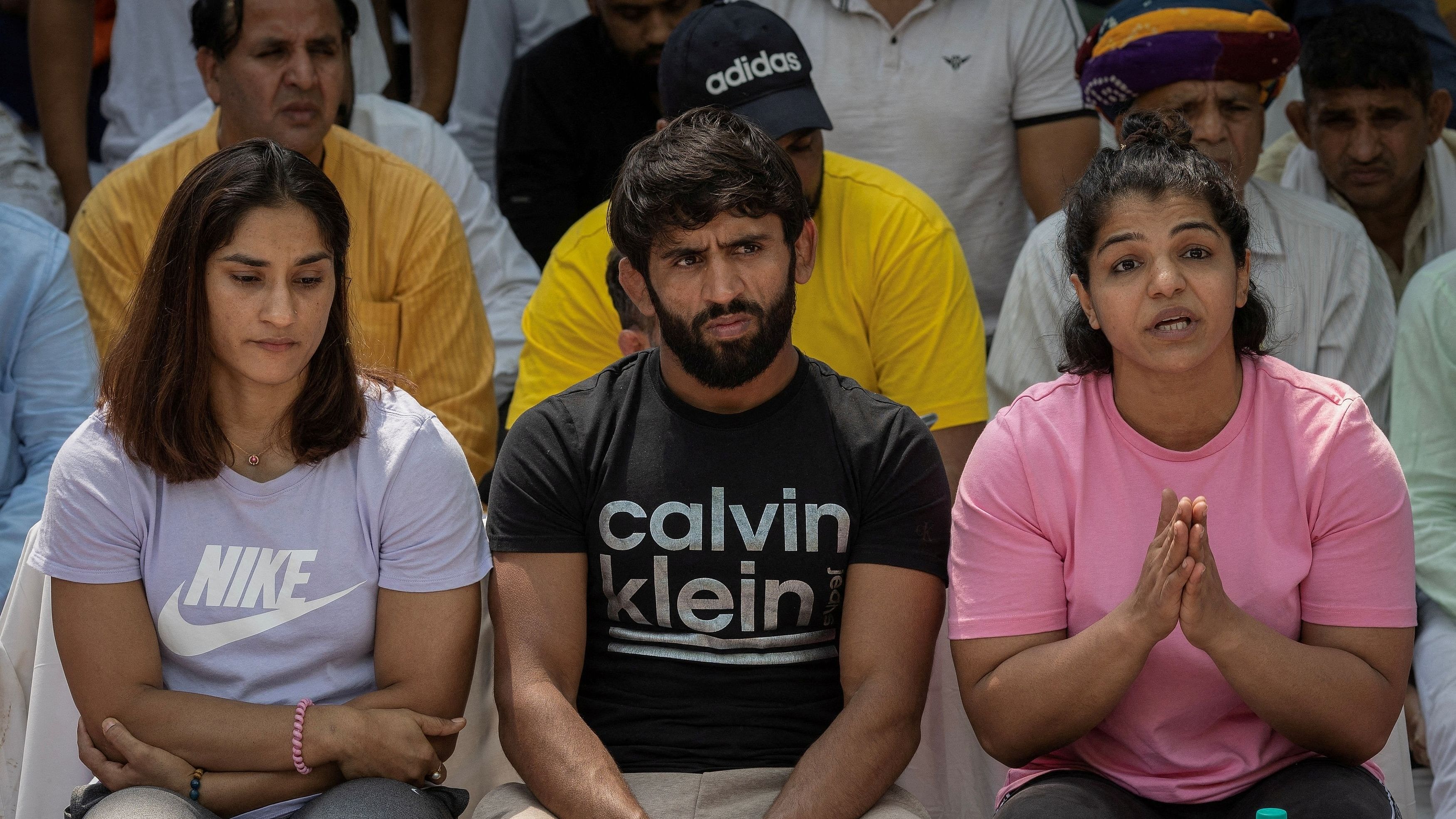 <div class="paragraphs"><p> Indian wrestlers Vinesh Phogat Bajrang Punia and Sakshi Malik address a news conference as they take part in a sit-in protest demanding the arrest of Wrestling Federation of India (WFI) chief who they accuse of sexually harassing female players in New Delhi </p></div>