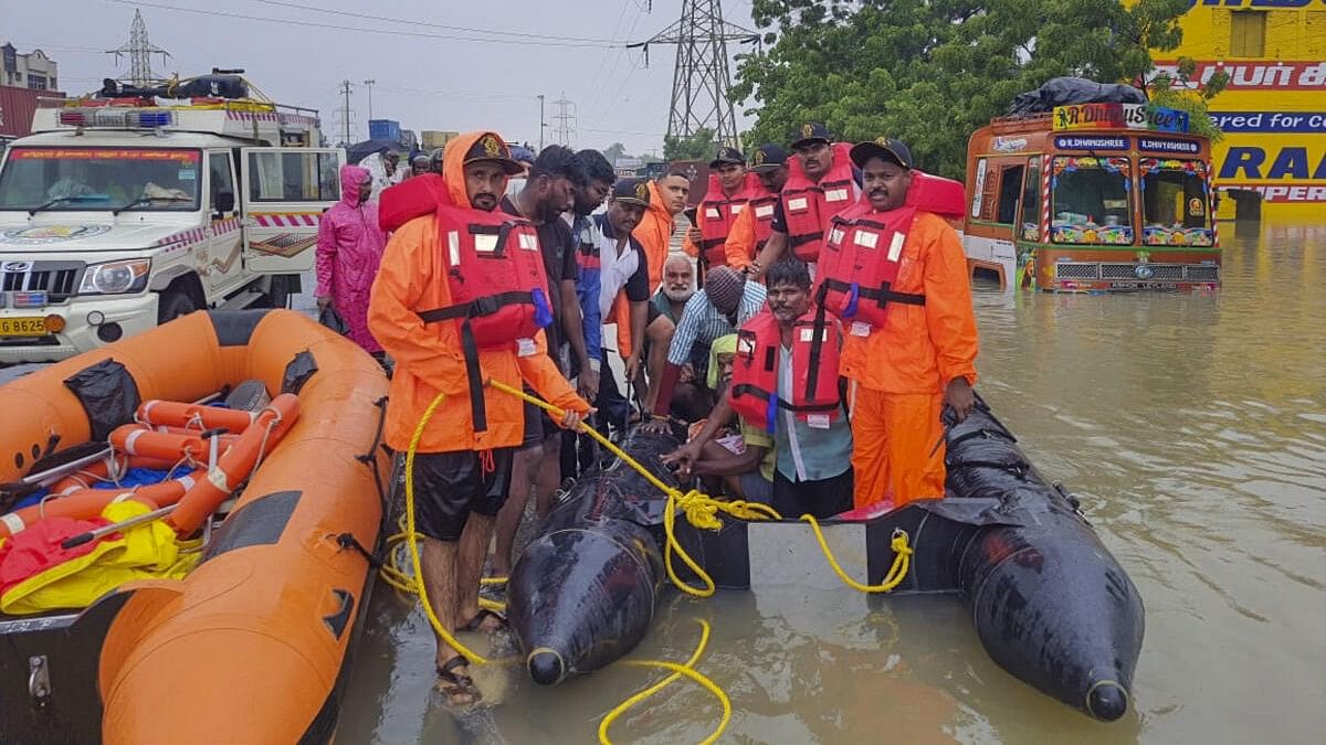 <div class="paragraphs"><p>Indian Coast Guard men at rescue work in flood-hit Tuticorin district of Tamil Nadu.</p></div>