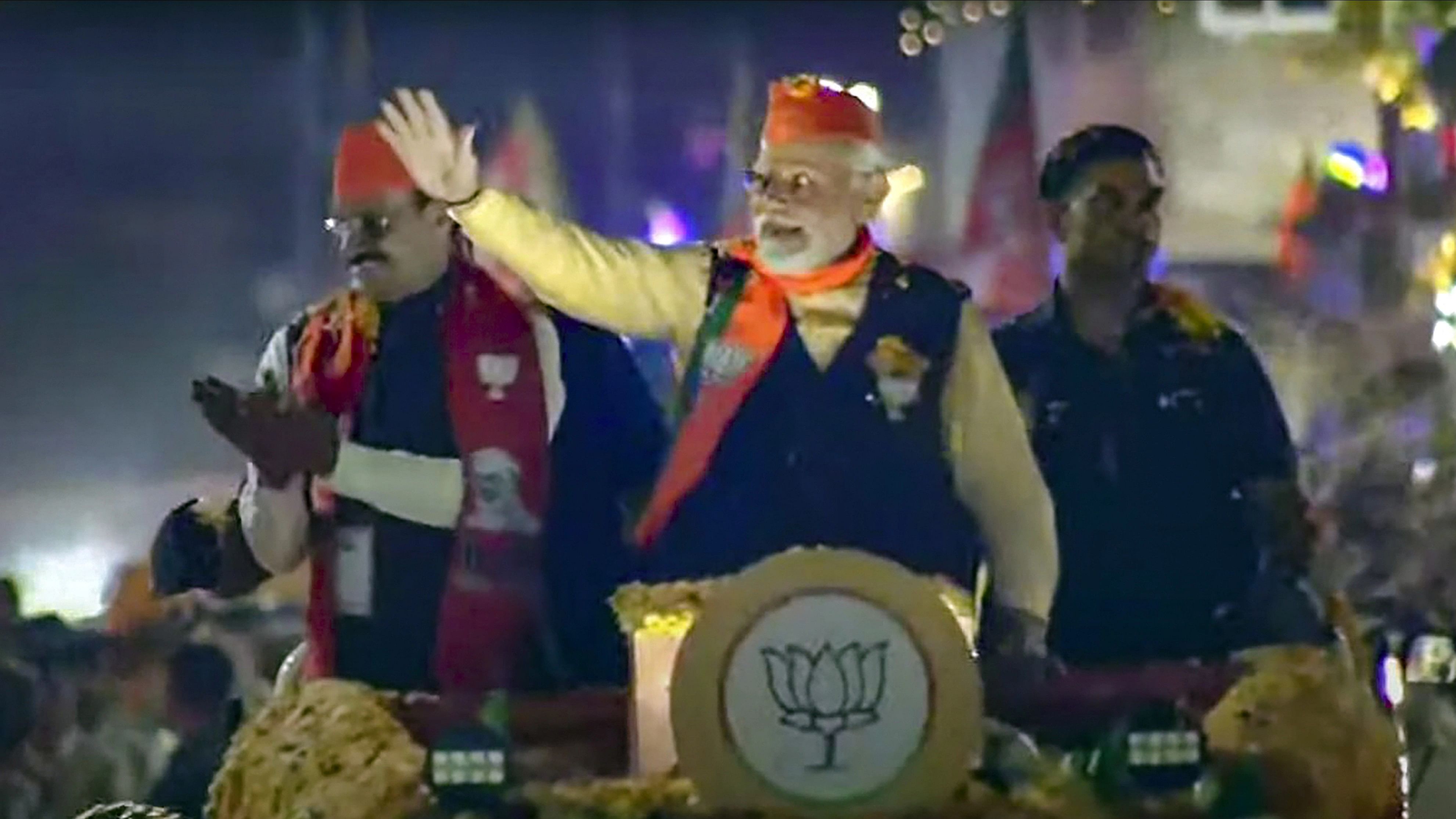 <div class="paragraphs"><p>File Photo: Prime Minister Narendra Modi waves at supporters during a roadshow ahead of the Madhya Pradesh Assembly elections, in Indore, Tuesday, Nov. 14, 2023.</p></div>