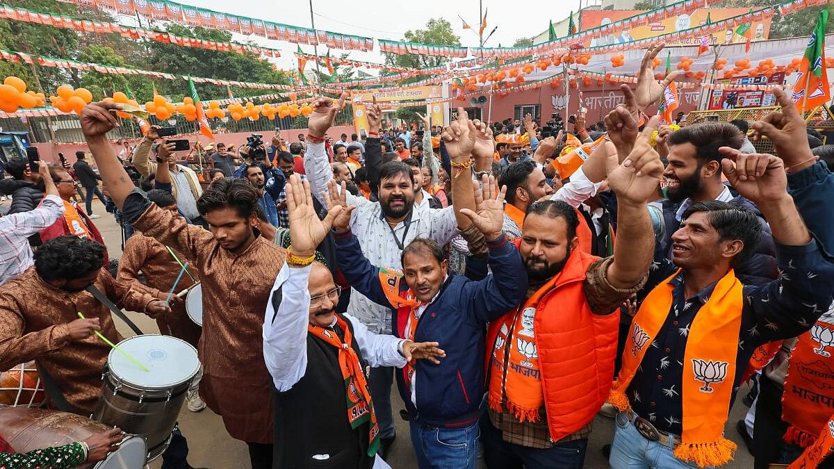 <div class="paragraphs"><p>BJP workers and supporters outside the party headquarters during counting of votes for the Rajasthan Assembly elections, in Jaipur</p></div>