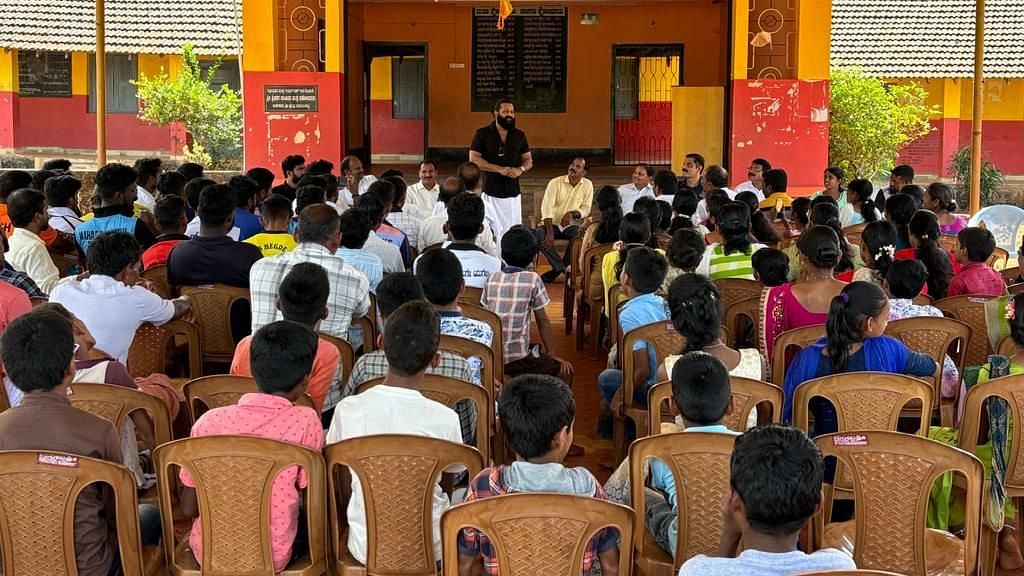 <div class="paragraphs"><p>Actor Rishab Shetty is seen addressing students and officials at a government school in his hometown Keradi, Karnataka.</p></div>