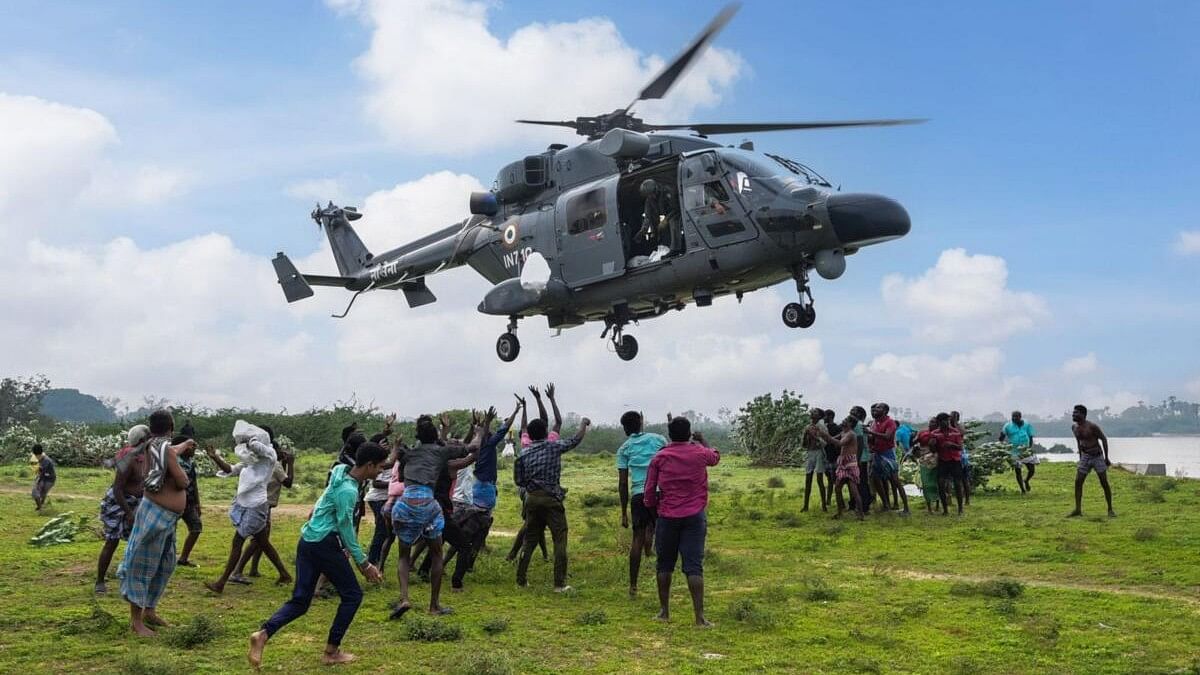 <div class="paragraphs"><p>Flood-affected people receive relief material from the Indian Navy personnel at a flood-hit area of Tamil Nadu, on Thursday, Dec. 21, 2023.</p></div>