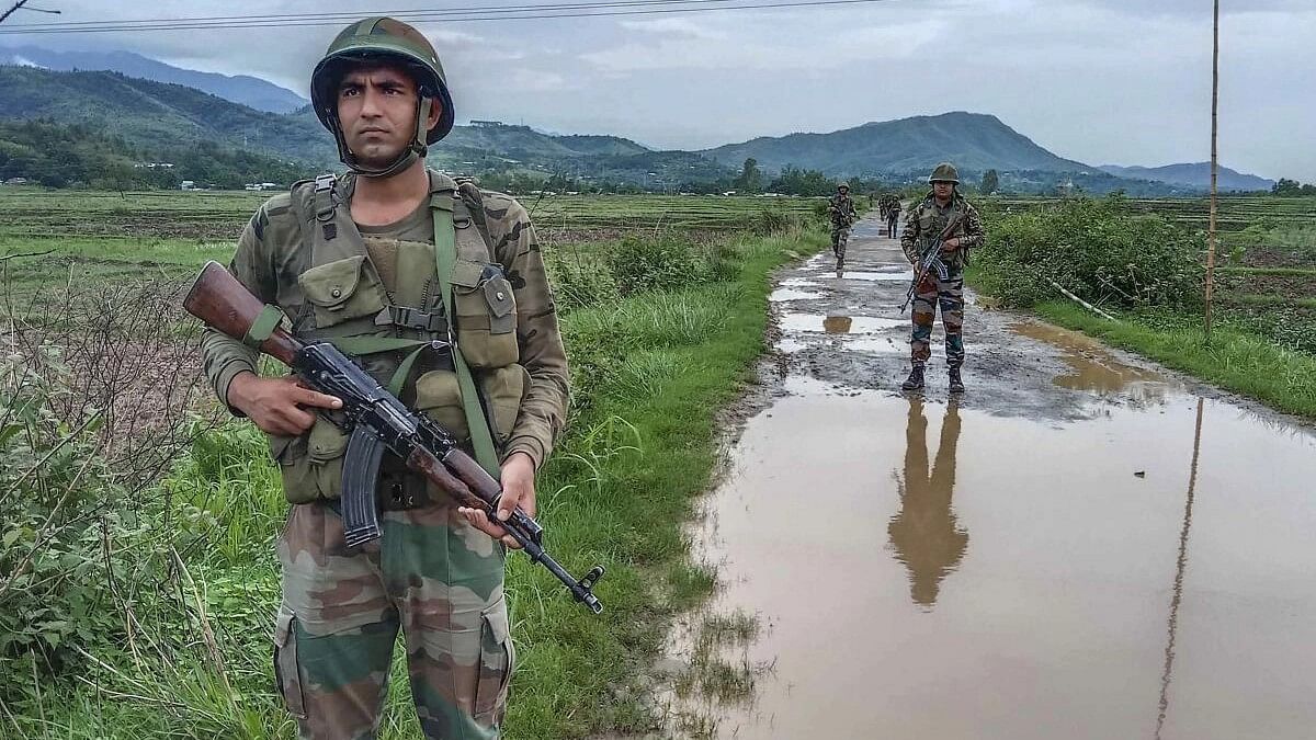 <div class="paragraphs"><p>Representative image of army officials patrolling in the violence-hit area, at Sanasabi in Imphal east district of Manipur</p></div>