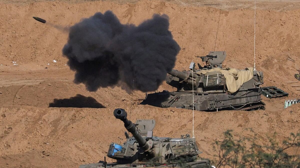 <div class="paragraphs"><p>An Israeli self-propelled artillery unit fires amid the ongoing conflict between Israel and the Palestinian Islamist group Hamas, as seen from southern Israel, December 26, 2023. </p></div>