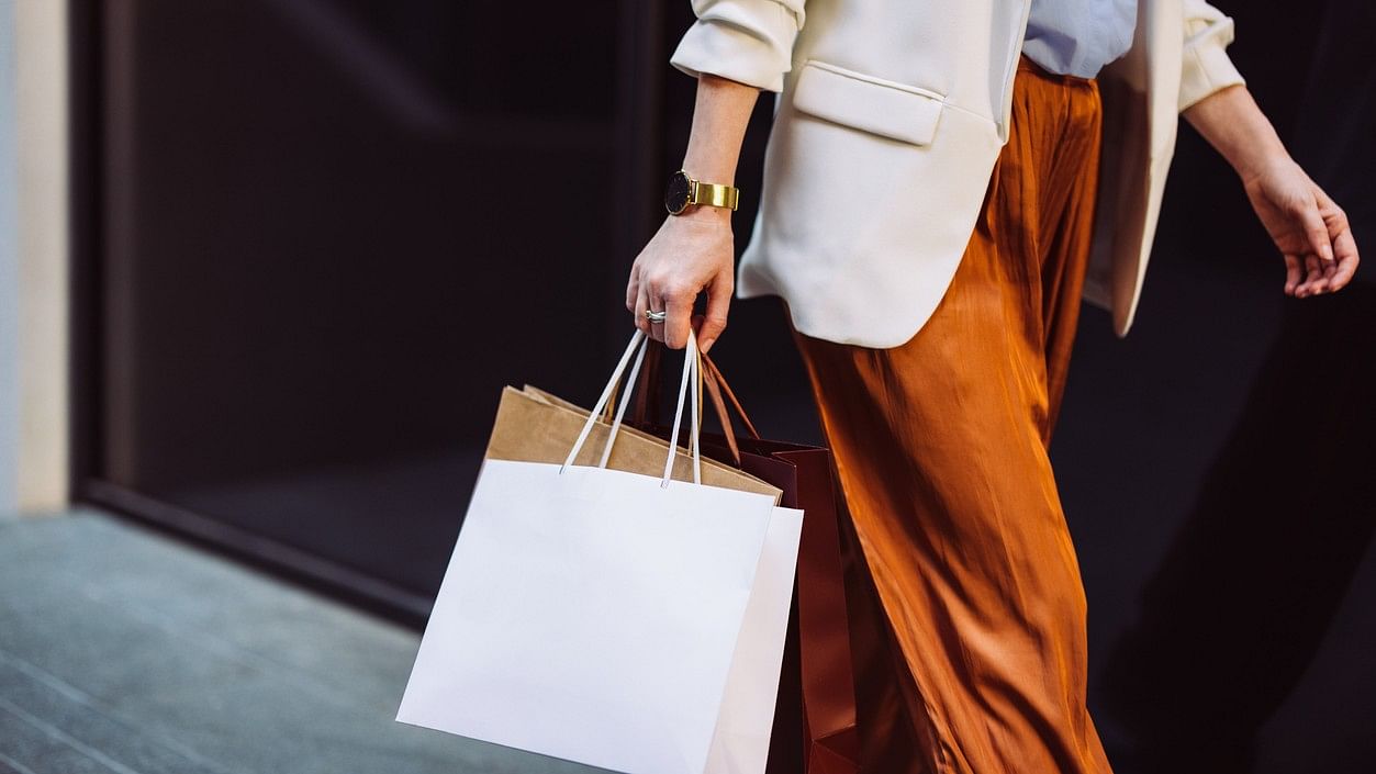 <div class="paragraphs"><p>Representative image of a woman carrying paper bags.</p></div>