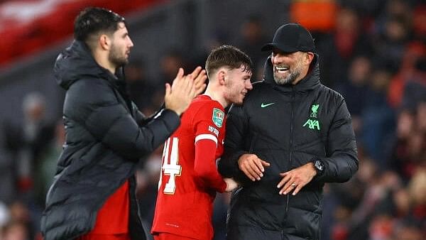 <div class="paragraphs"><p>Liverpool's Conor Bradley celebrates with manager Juergen Klopp after&nbsp;Liverpool v West Ham United quarter final at Anfield, Liverpool, Britain, on December 20, 2023</p></div>