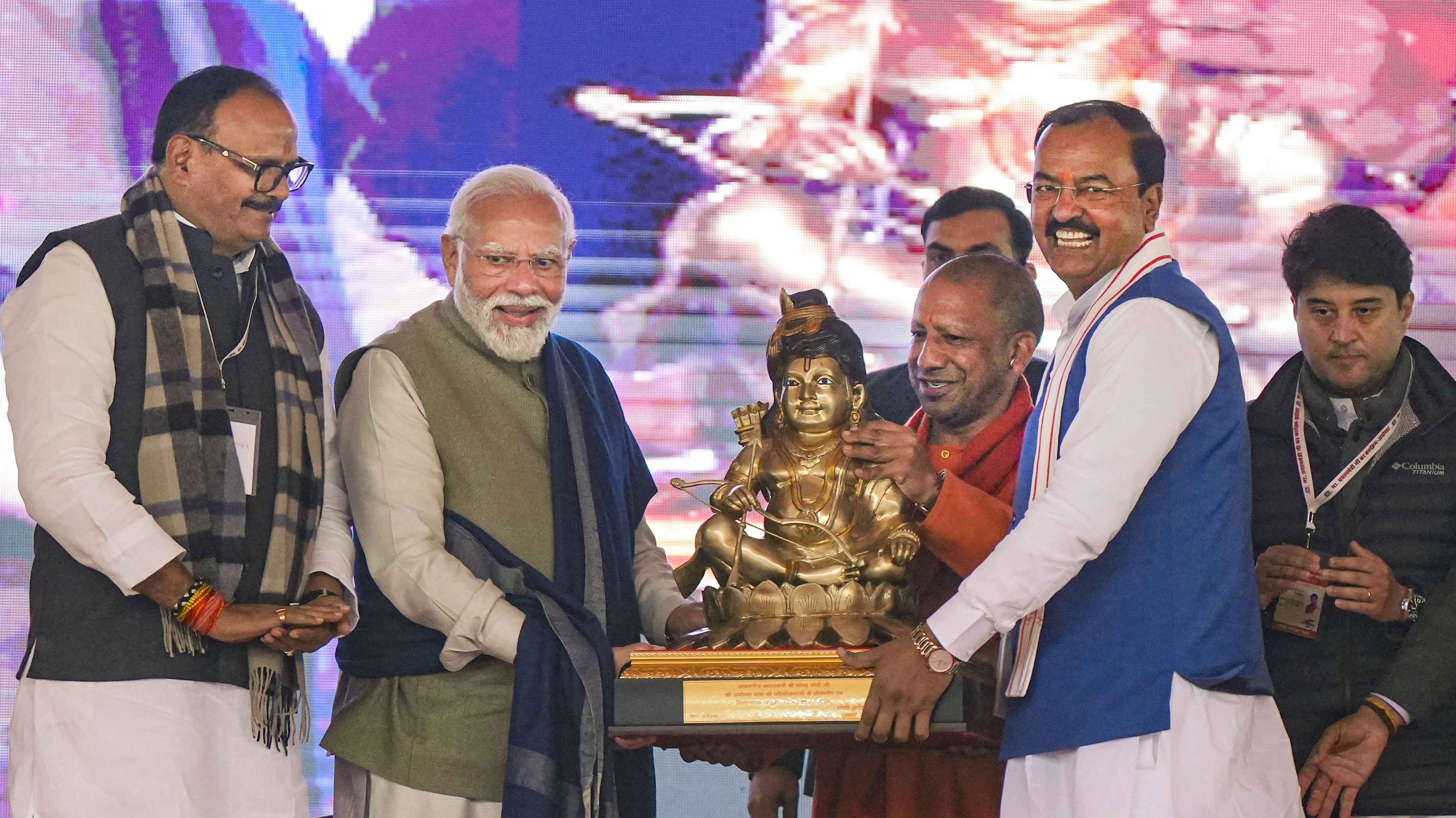 <div class="paragraphs"><p>Prime Minister Narendra Modi being felicitated by Uttar Pradesh Chief Minister Yogi Adityanath and Dy CM Keshav Prasad Maurya during a public meeting, in Ayodhya, Saturday, Dec. 30, 2023. </p></div>
