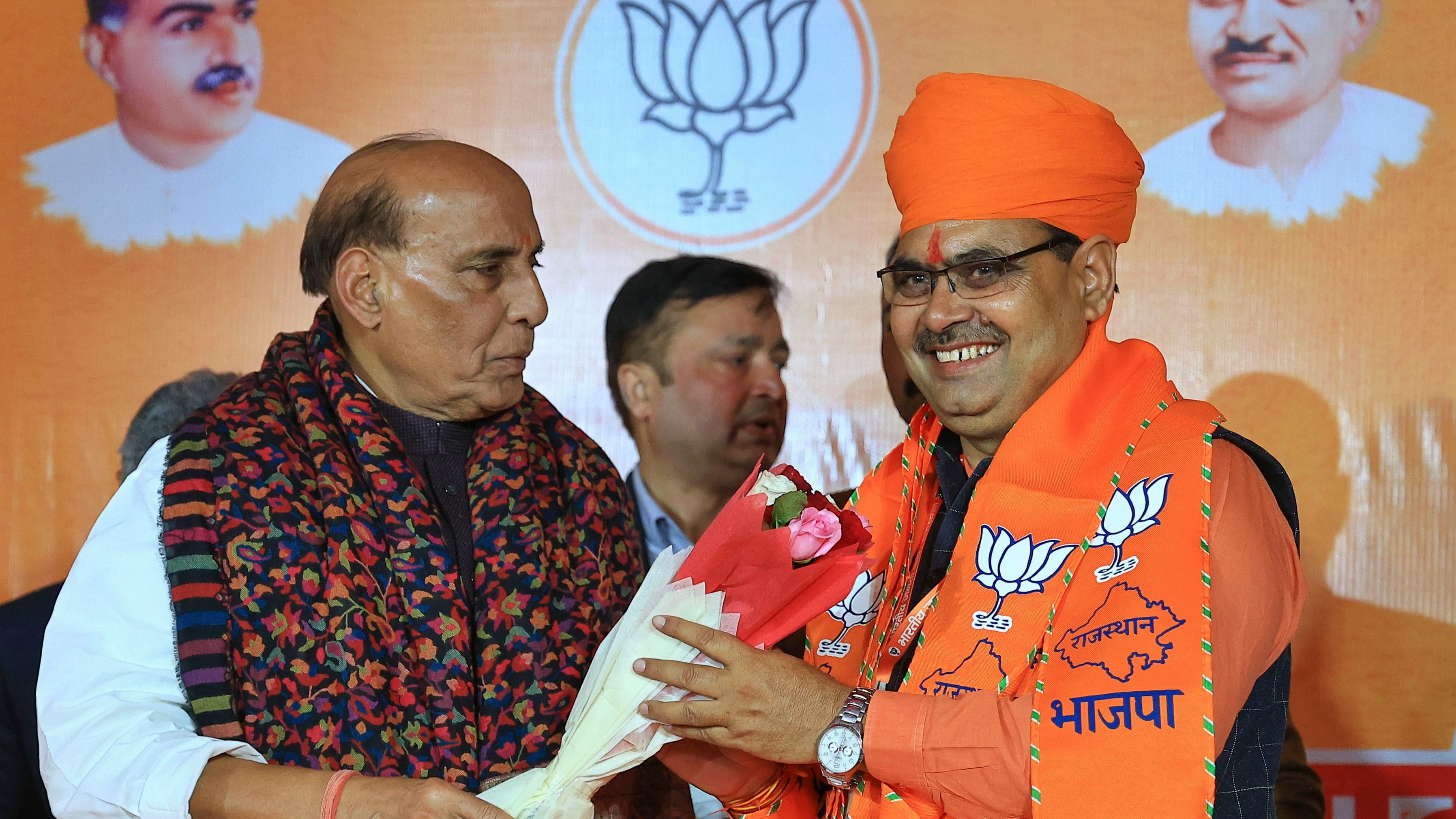 <div class="paragraphs"><p>Defence Minister and BJP central observer for Rajasthan Rajnath Singh greets newly-elected Rajasthan Chief Minister Bhajan Lal Sharma during BJP Legislature Party meeting, in Jaipur, Tuesday, Dec. 12, 2023.</p></div>