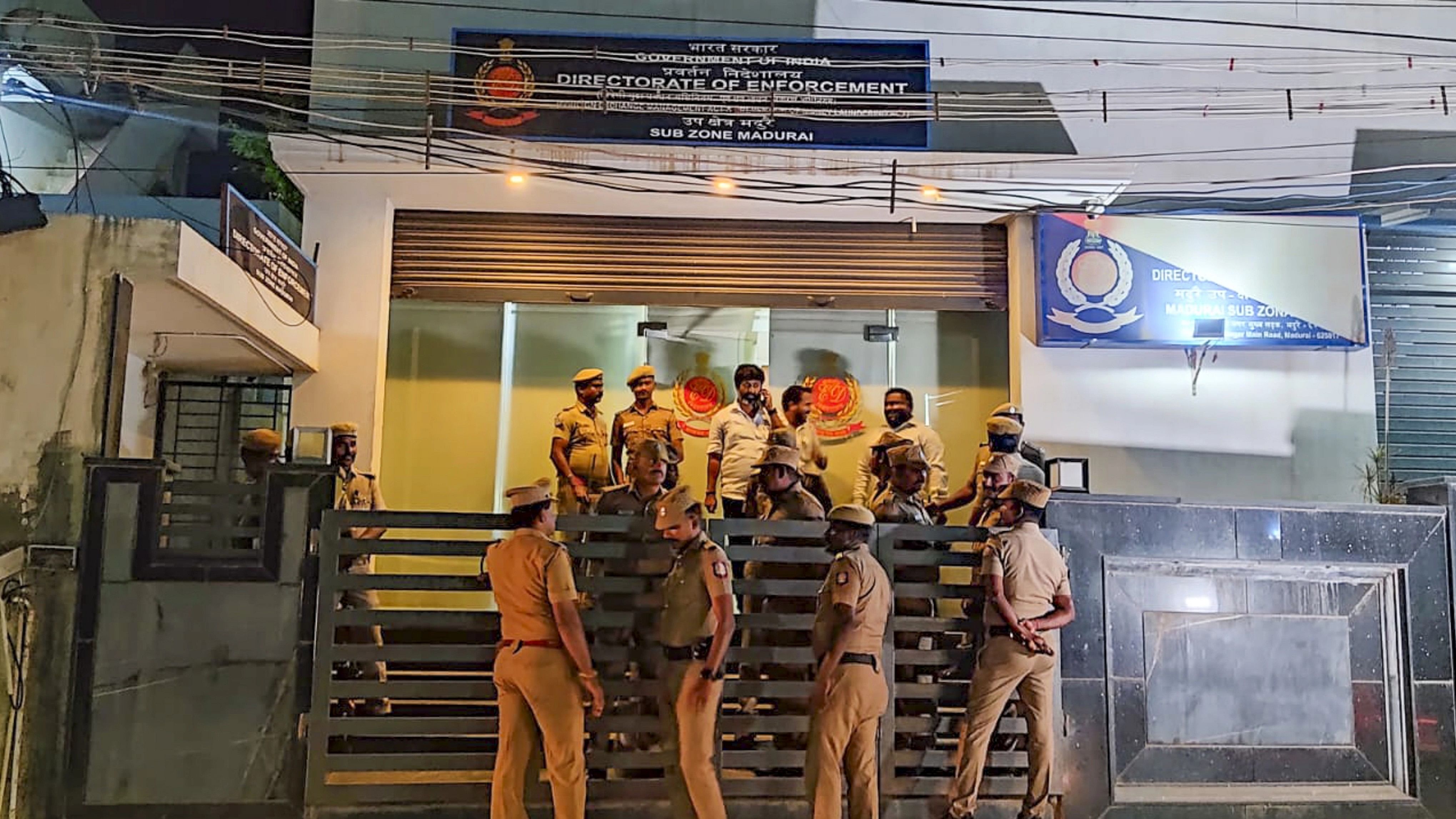 <div class="paragraphs"><p>Madurai: Police and Directorate of Vigilance and Anti-Corruption (DVAC) officials during a raid at the Enforcement Directorate's (ED) office after ED officer Ankit Tiwari was arrested for demanding and accepting a bribe of Rs 20 lakh from a government employee, in Madurai, Friday, Dec. 1, 2023. </p></div>