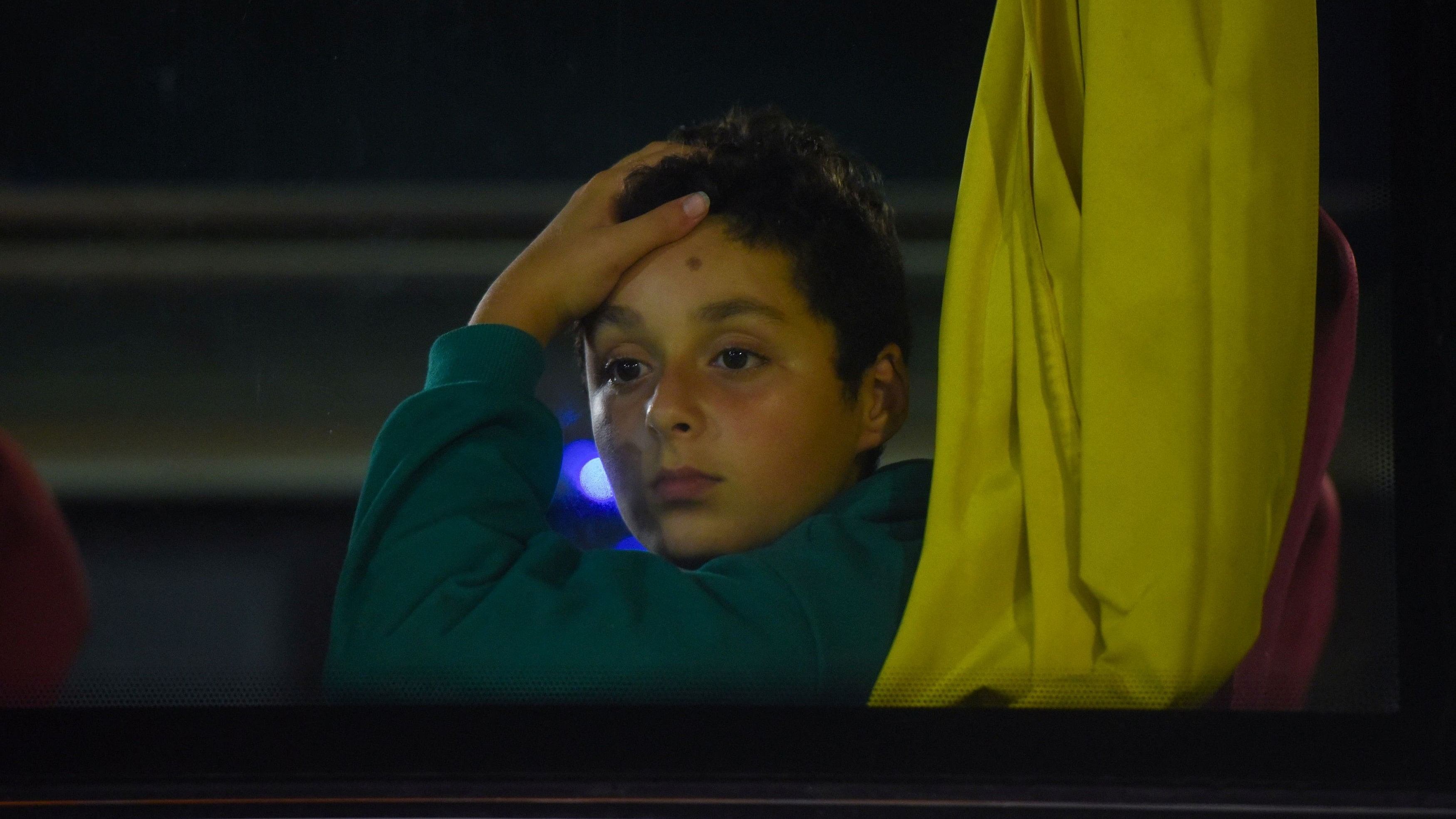 <div class="paragraphs"><p>A boy looks out of a bus window as Palestinians are evacuated amid the ongoing conflict between Israel and the Palestinian Islamist group Hamas.&nbsp;</p></div>