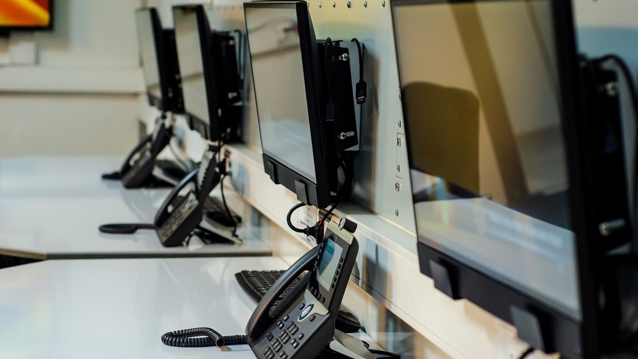 <div class="paragraphs"><p>Representative image of helpline phones kept at a desk.</p></div>