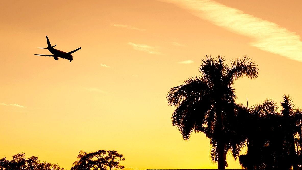 <div class="paragraphs"><p>A representational image showing a passenger plane fly across a sunset sky in Florida.</p></div>