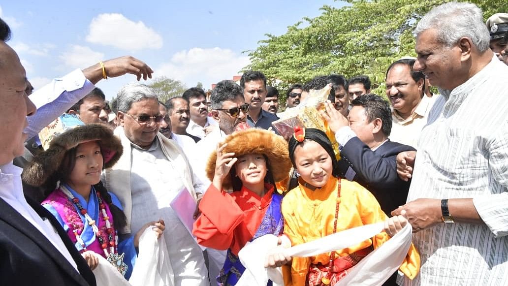 <div class="paragraphs"><p>CM Siddaramaiah welcomed at the helipad of 'Central School for Tibetans' ground at Bylakuppe camp 1 of Periyapatna of Mysuru district on Wednesday. </p></div>