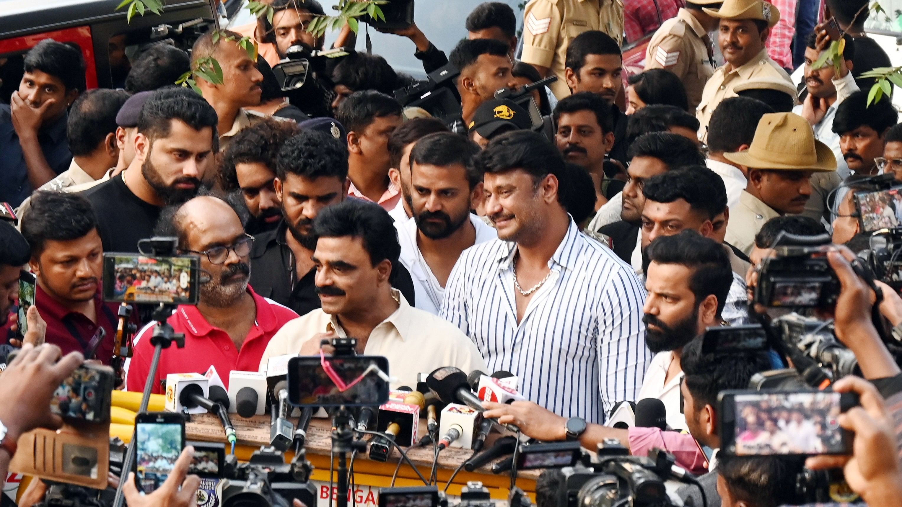 <div class="paragraphs"><p>Film producer Rockline Venkatesh and actor Darshan speak to media after appearing before the police, in Bengaluru on Friday. </p></div>