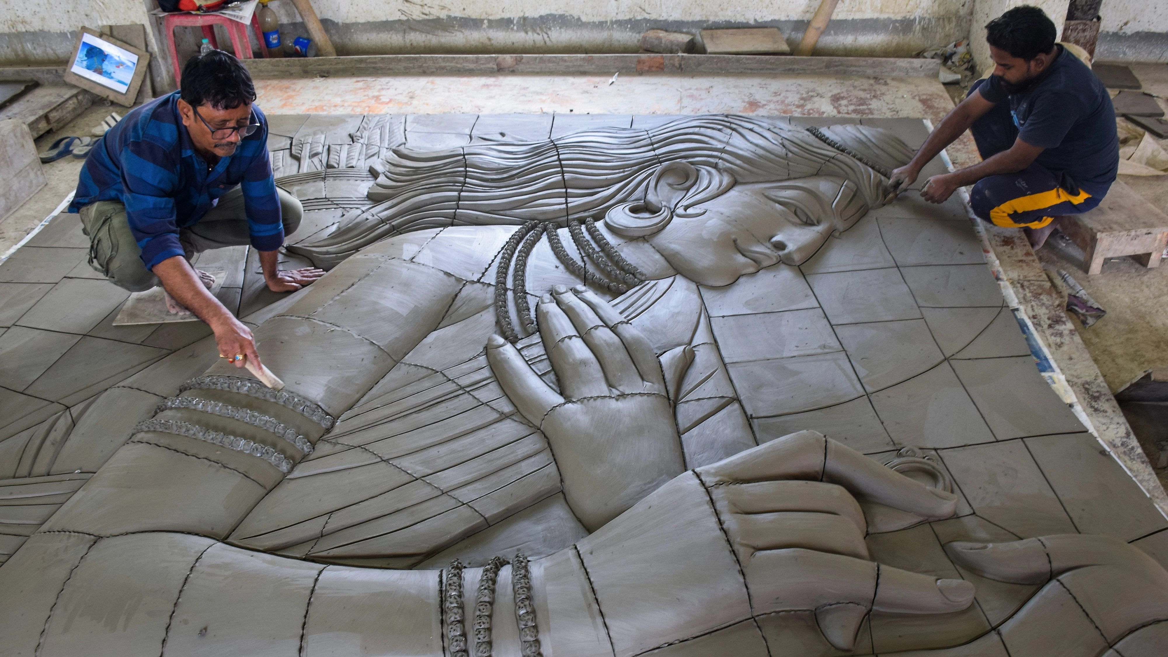 <div class="paragraphs"><p>Biswajit Majumder, a terracotta artist, works on murals  to decorate the entrance of the Lord Ram temple in Ayodhya. </p></div>