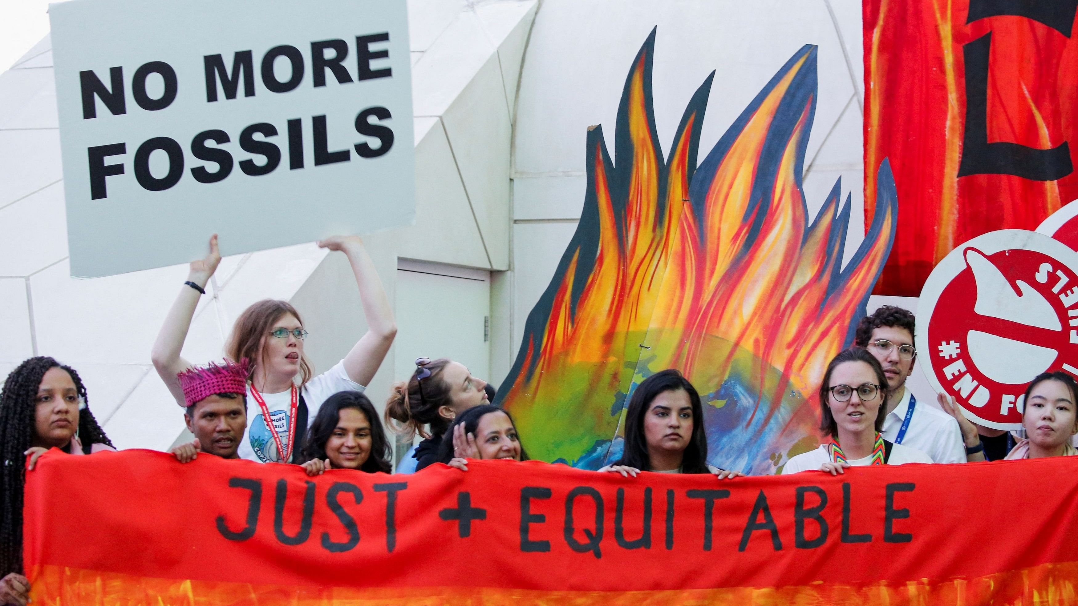 <div class="paragraphs"><p>Climate activists protest against fossil fuels at Dubai's Expo City during the United Nations Climate Change Conference COP28 in Dubai.</p></div>