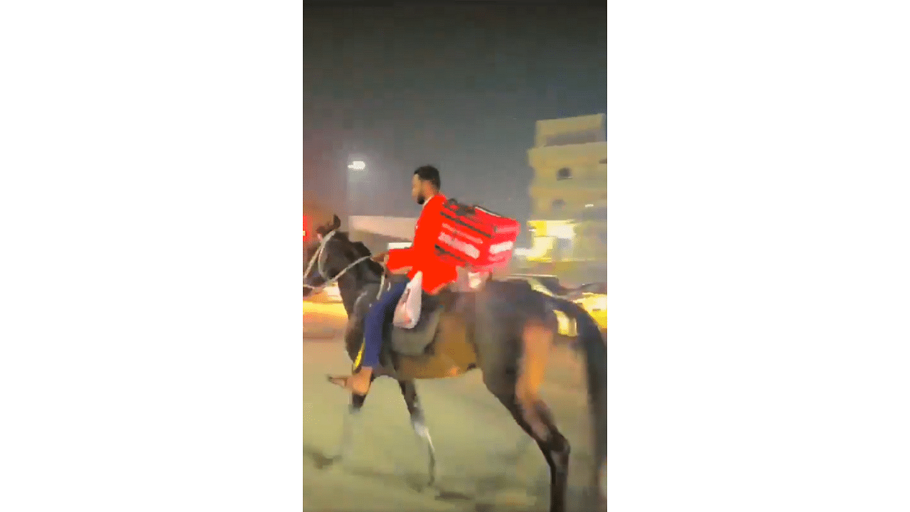 <div class="paragraphs"><p>Screengrab of video showing Zomato delivery agent on horseback in Hyderabad.</p></div>