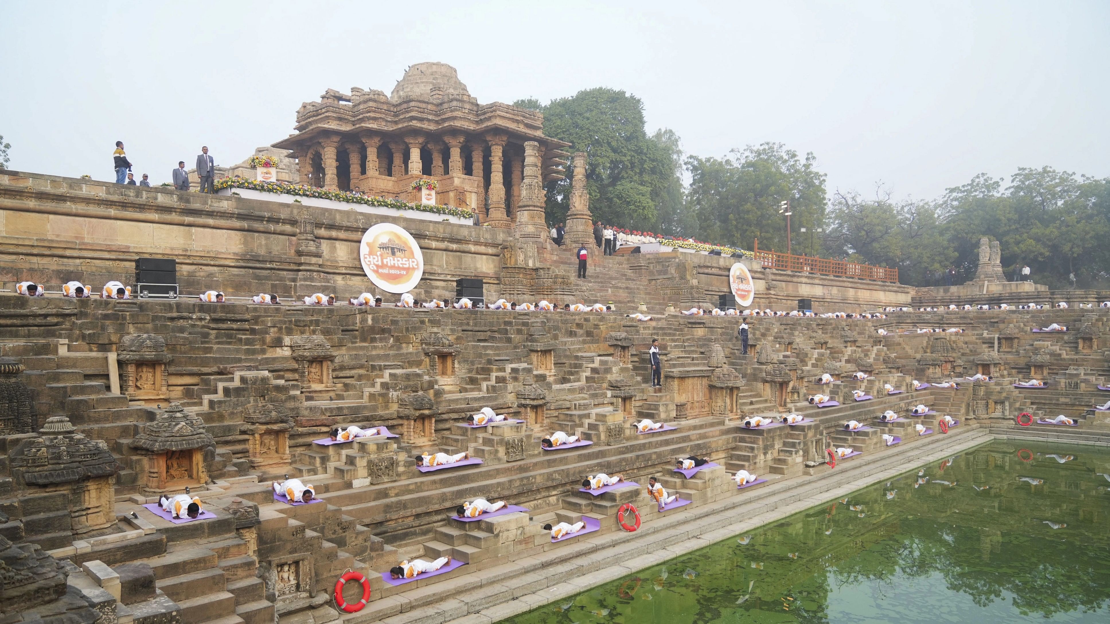 <div class="paragraphs"><p> People perform Surya Namaskar at an event organised at the Sun Temple at Modhera.</p></div>