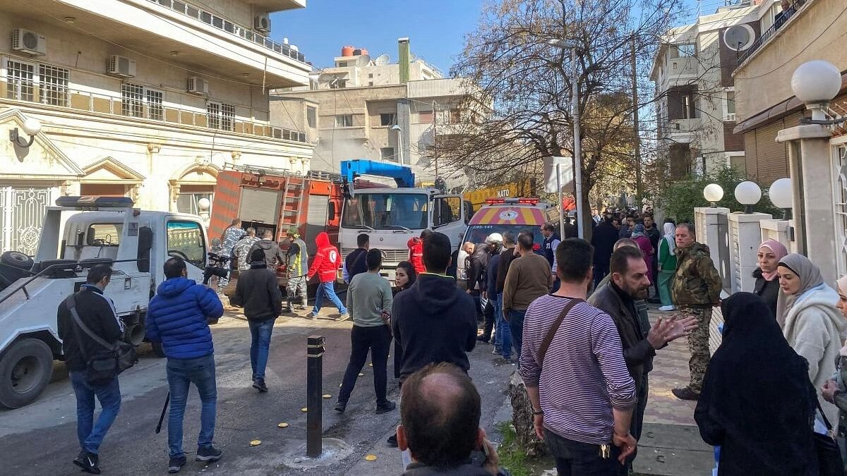 <div class="paragraphs"><p>People gather near the damaged site, that was hit by an Israeli military strike according to sources, in Damascus, Syria January 20, 2024.</p></div>